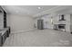 Open concept area featuring a kitchen with white cabinetry and stainless appliances at 10405 Club Car Ct, Mint Hill, NC 28227