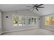 Bright sunroom with vaulted ceilings and serene backyard views at 10405 Club Car Ct, Mint Hill, NC 28227