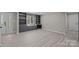 Spacious room with hardwood floors and a built-in bookcase and window seat at 10405 Club Car Ct, Mint Hill, NC 28227