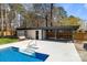 Backyard featuring a pool, swing, and a pool house on a sunny day with blue skies at 10405 Club Car Ct, Mint Hill, NC 28227