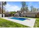 Backyard featuring a pool and a two-story home on a sunny day at 10405 Club Car Ct, Mint Hill, NC 28227