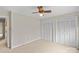 Bedroom featuring neutral carpeting, a ceiling fan, and closet space at 105 Baymount Dr, Statesville, NC 28625