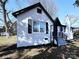 Side view of renovated brick home featuring black trim and well maintained landscaping at 106 Easy St, Concord, NC 28027