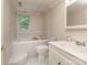 Bathroom featuring tile flooring, bath tub, vanity, and commode at 109 Joe Teague Rd, Hickory, NC 28601