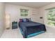 Comfortable bedroom with dual windows, carpet, a dark comforter, and neutral wallpaper at 109 Joe Teague Rd, Hickory, NC 28601