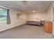 Bedroom featuring neutral decor, carpet flooring, a window, and closet at 109 Joe Teague Rd, Hickory, NC 28601