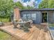 Outdoor seating area with table, umbrella, and four chairs on a wooden deck at 109 Joe Teague Rd, Hickory, NC 28601