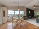 Dining area with a glass table and four rattan chairs overlooking a scenic view at 109 Joe Teague Rd, Hickory, NC 28601