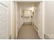 Hallway with carpet flooring, flower-themed border, and storage at 109 Joe Teague Rd, Hickory, NC 28601