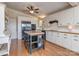 Well-lit kitchen boasts white cabinets, stainless steel appliances, and a wood-top island with seating at 109 Joe Teague Rd, Hickory, NC 28601