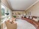 Large living room boasting a curved leather sofa, built-in shelving, and lots of natural light at 109 Joe Teague Rd, Hickory, NC 28601