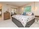 Comfortable bedroom featuring a floral bed, carpet flooring, natural lighting, dresser, and mirrored closet at 109 Joe Teague Rd, Hickory, NC 28601