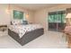 Inviting bedroom with carpet, floral bedding, a platform bed, and a sliding glass door to the outside at 109 Joe Teague Rd, Hickory, NC 28601