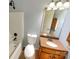 Traditional bathroom featuring a single sink vanity and a shower-tub combo at 10940 Wild Dove Ln, Charlotte, NC 28277