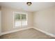 Clean bedroom with neutral carpet, paint, baseboard trim and a window with blinds at 1125 Bugle Ln, Newton, NC 28658