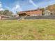 Large backyard with a brick home featuring a spacious deck, perfect for outdoor living and entertaining at 114 Joe Teague Rd, Hickory, NC 28601