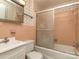 Bathroom featuring a shower with glass door, vanity, and patterned wallpaper at 114 Joe Teague Rd, Hickory, NC 28601