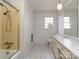 Bathroom featuring a shower with glass door, a vanity with mirror, and a window for natural light at 114 Joe Teague Rd, Hickory, NC 28601