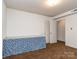 Clean bedroom featuring a table, closet, and light colored carpet at 114 Joe Teague Rd, Hickory, NC 28601