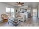Cozy living room with hardwood flooring, large sliding glass doors to deck, and access to kitchen at 114 Joe Teague Rd, Hickory, NC 28601