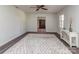 Bright living room featuring a large rug, ceiling fan, and views of other spaces at 114 Joe Teague Rd, Hickory, NC 28601
