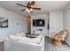 Comfortable living room with hardwood floors and a large television mounted on the wall at 114 Joe Teague Rd, Hickory, NC 28601