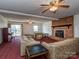 Large living room with brick fireplace, ceiling fans, and sliding glass doors to the outdoors at 114 Joe Teague Rd, Hickory, NC 28601