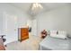 Comfortable bedroom with carpet, features a dresser and a doorway that provides access to other living spaces at 122 Blandina Ct, Fort Mill, SC 29708