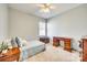 Cozy bedroom featuring a twin bed, carpet, and a wooden desk providing a comfortable and functional space at 122 Blandina Ct, Fort Mill, SC 29708