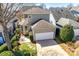 Well-maintained two-story home featuring a two-car garage and a beautifully landscaped backyard patio area at 122 Blandina Ct, Fort Mill, SC 29708