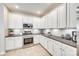 Bright kitchen with stainless steel appliances, white cabinetry, and tiled backsplash at 122 Blandina Ct, Fort Mill, SC 29708