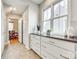 Bright kitchen with window, white cabinetry, and tiled floor at 122 Blandina Ct, Fort Mill, SC 29708