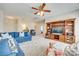 Warm living room featuring cozy blue sofas, an entertainment center, and carpeted floors offering a welcoming place to relax at 122 Blandina Ct, Fort Mill, SC 29708