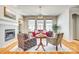 Inviting living room featuring a fireplace, hardwood floors, and ample natural light for a cozy atmosphere at 122 Blandina Ct, Fort Mill, SC 29708