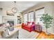 Bright living room featuring a fireplace, hardwood floors, and multiple windows for lots of natural light at 122 Blandina Ct, Fort Mill, SC 29708