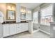 Elegant main bathroom featuring marble walk-in shower, dual vanities, and ample lighting for a luxurious spa experience at 122 Blandina Ct, Fort Mill, SC 29708