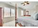 Bright main bedroom with a four-poster bed, dresser, and large windows creating a serene and inviting atmosphere at 122 Blandina Ct, Fort Mill, SC 29708
