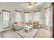 Cozy sun room filled with sunlight, neutral furniture, and a colorful rug at 122 Blandina Ct, Fort Mill, SC 29708