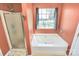 Bathroom featuring a tub, window and glass shower at 1229 Kent Dr, Lancaster, SC 29720