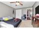 Neutral bedroom featuring a ceiling fan, closet doors, and view into the hallway at 1229 Kent Dr, Lancaster, SC 29720