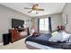 Neutral bedroom featuring ceiling fan, window, dresser with television, and comfortable-looking bed at 1229 Kent Dr, Lancaster, SC 29720