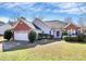Charming single-story home with a brick accent, two-car garage, and a well-manicured lawn at 1229 Kent Dr, Lancaster, SC 29720
