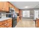 Bright eat-in kitchen boasts stainless steel appliances and natural light from a window at 1229 Kent Dr, Lancaster, SC 29720