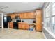 Kitchen area featuring wood cabinets, black appliances, and light countertops at 1229 Kent Dr, Lancaster, SC 29720