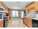 Kitchen features wood cabinets, stainless steel appliances and a dining area at 1229 Kent Dr, Lancaster, SC 29720