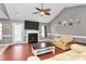 View of the living room offering a ceiling fan and fireplace with a mounted television above at 1229 Kent Dr, Lancaster, SC 29720