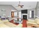 Living room with vaulted ceilings, fireplace, fan and wood floors at 1229 Kent Dr, Lancaster, SC 29720