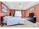 Main bedroom with king bed, ceiling fan and neutral walls and carpet at 1229 Kent Dr, Lancaster, SC 29720