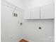 Functional laundry room with shelving and storage cabinets for laundry essentials at 130 Clydesdale Ct, Matthews, NC 28104
