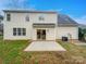 Spacious backyard featuring a concrete patio perfect for entertaining with the house in the background at 1400 Wessex Ct, Monroe, NC 28110